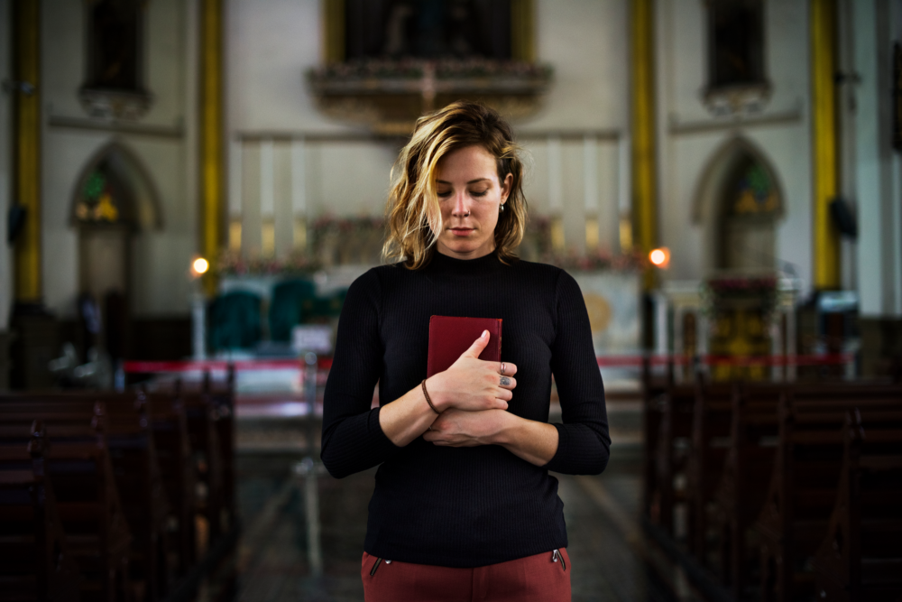 woman-praying-in-the-church-2023-11-27-04-51-39-utc